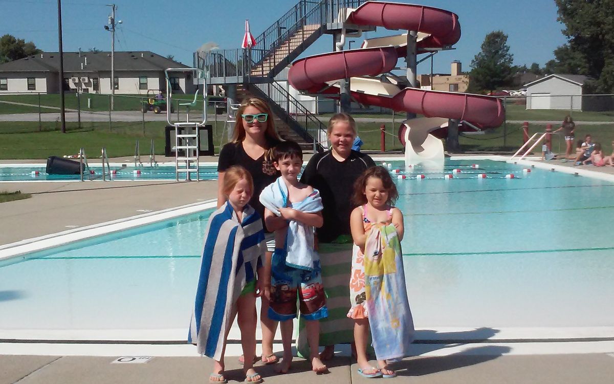 Image of Mom and 4 kids at pool