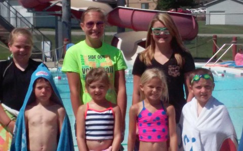 Image of 7 kids at pool